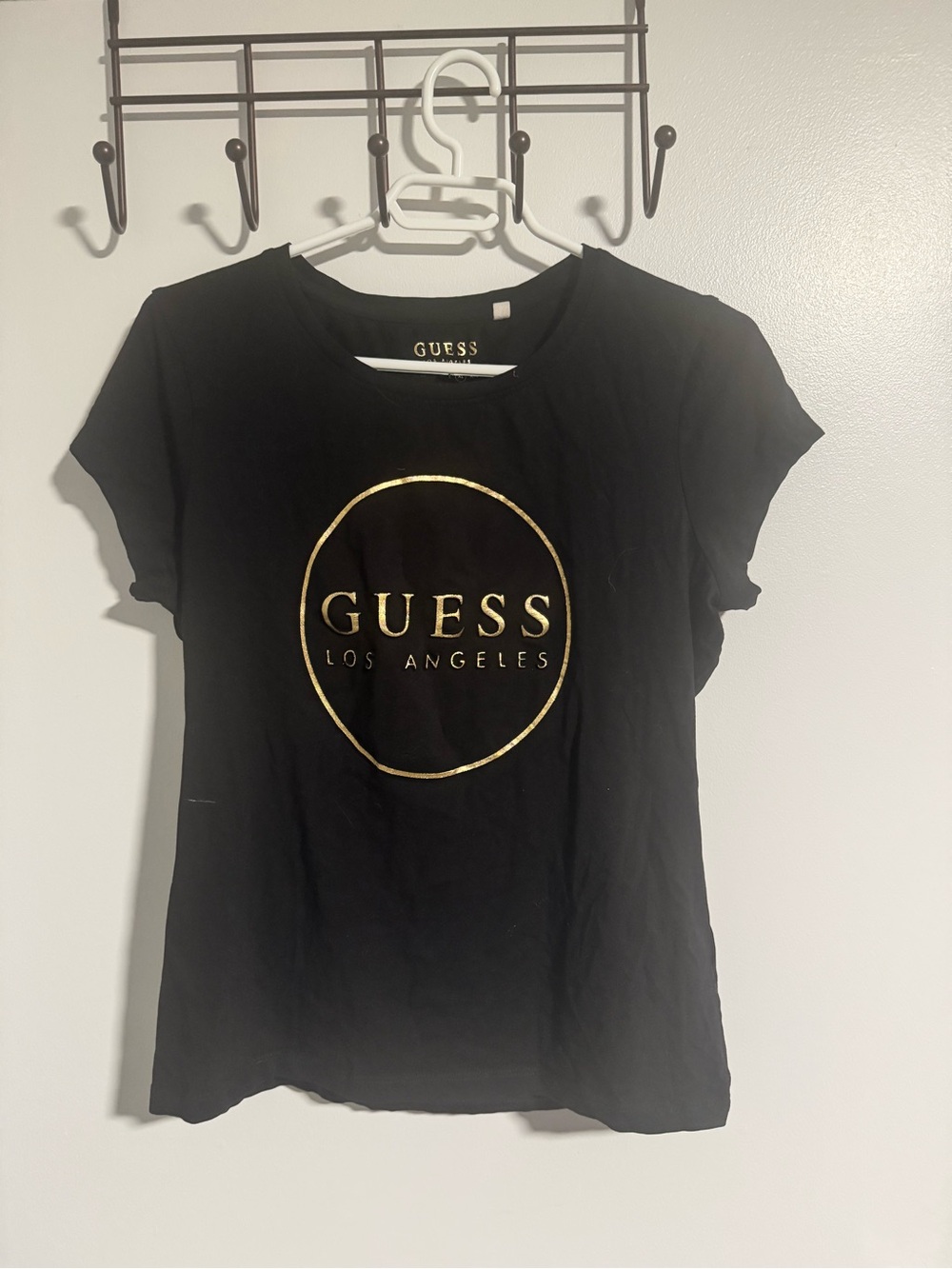 GUESS Black Short Sleeve Tee with Gold Logo Circle